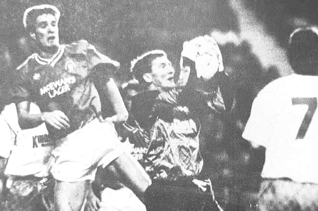 Gordon Arthur is challenged by Rangers' Richard Gough in a Skol Cup match at Ibrox in 1990