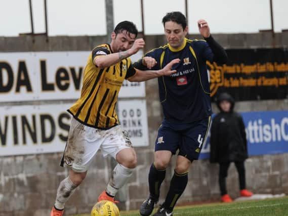 East Fife's Chris Duggan shrugs off the attention of Alloa's Frank McKeown. Picture by G McLuskie.
