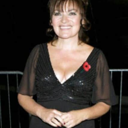 Lorraine Kelly wearing the dress now up for auction.