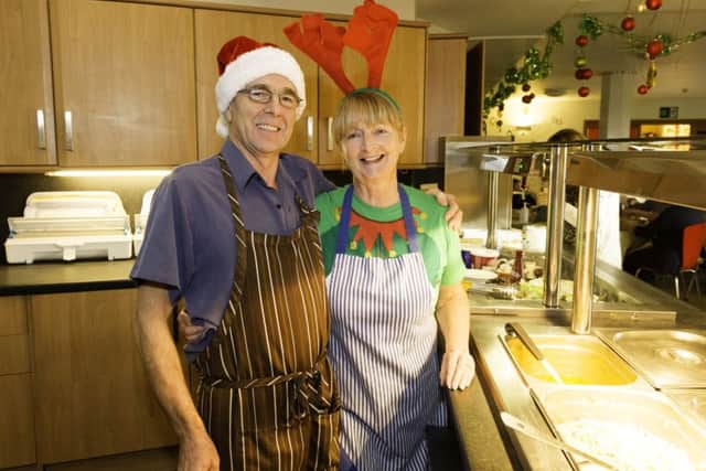 Happy to help...at Rachel House in Kinross at Christmas,  Donald Campbell  from Kincardine and Maureen Spence from Lochgelly in Fife. Picture: Paul Hampton