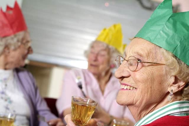 Raising a glass... and plenty of smiles, Community Christmas aims to ensure that no-one is 
alone on Christmas Day