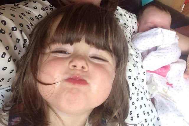 Edie with baby sister Annie