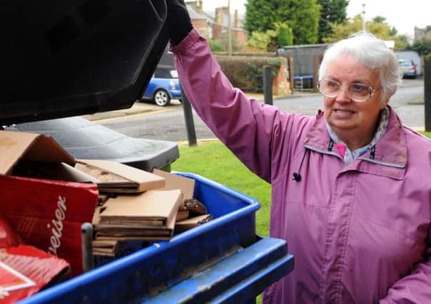 Celia Proctor with one of the full recycling bins. Pic: FPA