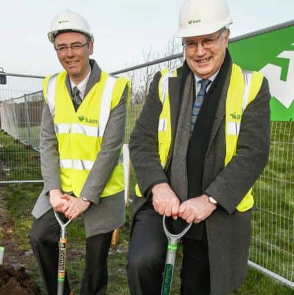 Minister for Learning Alasdair Allan and council leader David Ross get to work at the site of the new Waid.