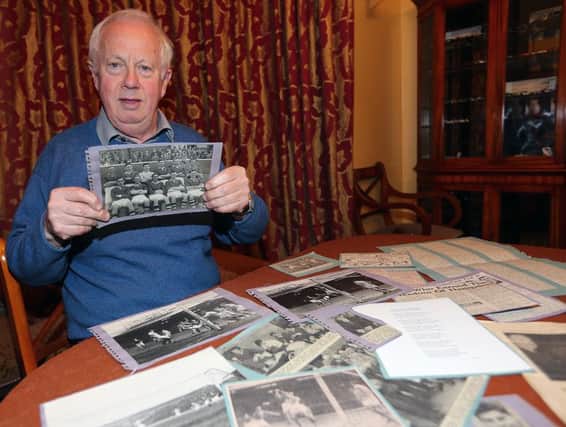 Ian with some of the newspaper cuttings and photos he received from Mr Bisset (Photo: Dave Scott).