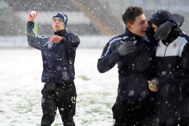 Raith youth players frolic in the snow following the late call-off -  credit - fife photo agency -