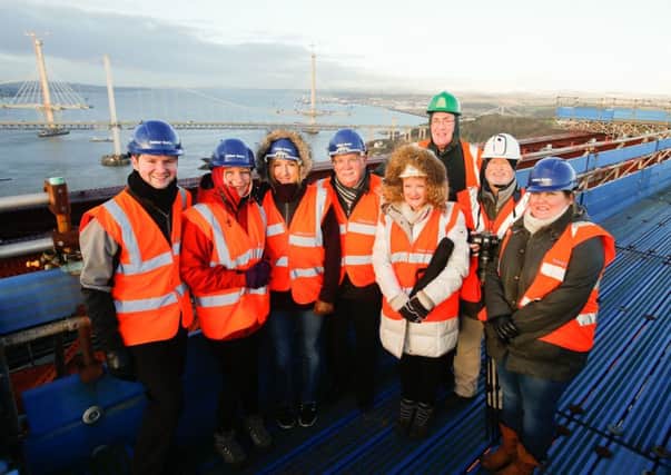 Some of the champions take in the view from the top of the Forth Bridge.