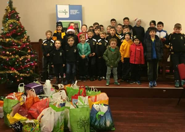 Youngsters from East Fife Juniors FC donate food and parcels to the Levenmouth Foodbank project Christmas 2015