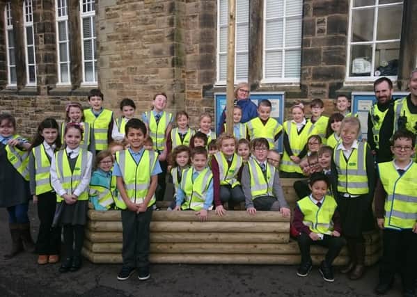 Kirkcaldy West Primary pupils who take part in three "walking buses" to school in the mornings, with PCs Mike Daglish and Martin Hayward who also help through Police Parksafe campaign.