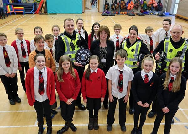 Members of the pupil council at Castlehill with, from left - Councillor Margaret Kennedy, Constable Robert Crawford, head teacher Marion McFarlane, Constable Tracey Alexander and Sergeant Ewan Pearce.