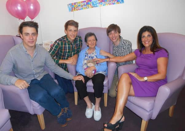 Christopher Mudie (second from left) with his gran Maria, brothers Daniel and Alex and mum Georgina