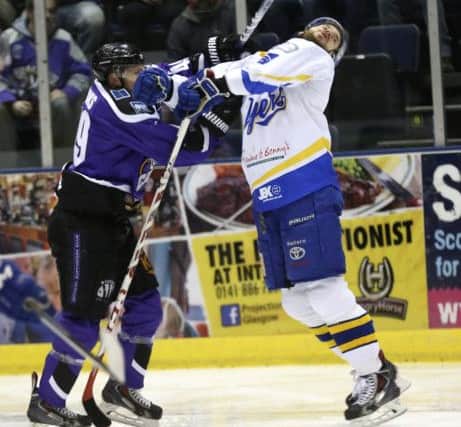 Braehead's Brendan Brooks earned a 2+10 for checking to the head - and a review from DOPS - for this hit on Phil Paquet. Pic: Steve Gunn