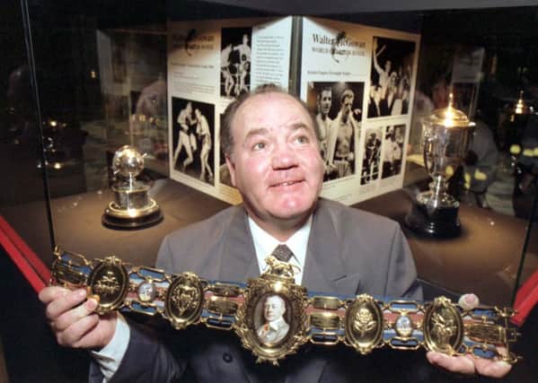 Scottish boxing legend Walter McGowan holding a Lonsdale belt, at an exhibition honouring him at Kelvingrove art gallery in Glasgow, October 1992.