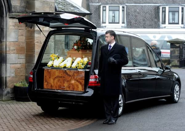 The hearse with a floral message in tribute to Mary Logie (picture by George McLuskie