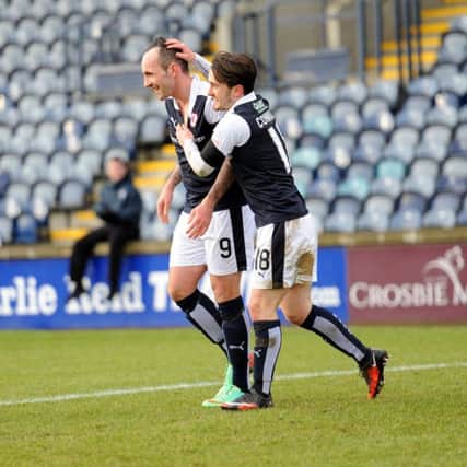 Mark Stewart is congratulated by Aidan Connolly after opening the scoring - Credit - Fife Photo Agency -