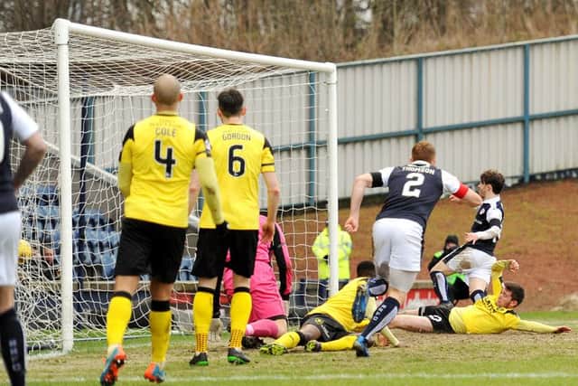 Aidan Connolly scores Rovers' second goal - Credit - Fife Photo Agency -
