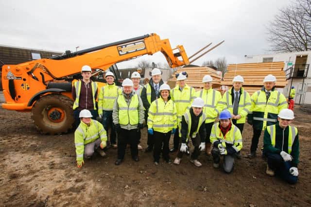 Councillors and staff on site at Tantallon Avenue with apprentices from both the council and sub-contractors working on the Affordable Housing Programme.