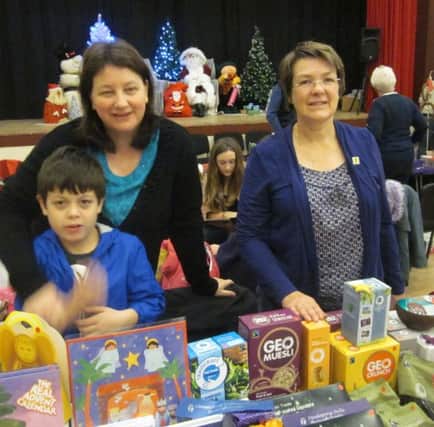 Cupar FairTrade group's secretary Jackie Arreaza, her son Andrew, and Sally Mottram at the Traidcraft stall at Christmas