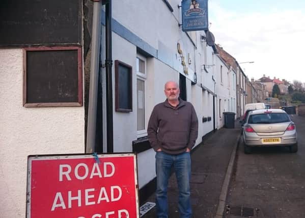 Man i' the Rock pub owner Jack Kerr who has appealed for Fife Council to repair the road outside his pub or give him a rates cut for the premises.