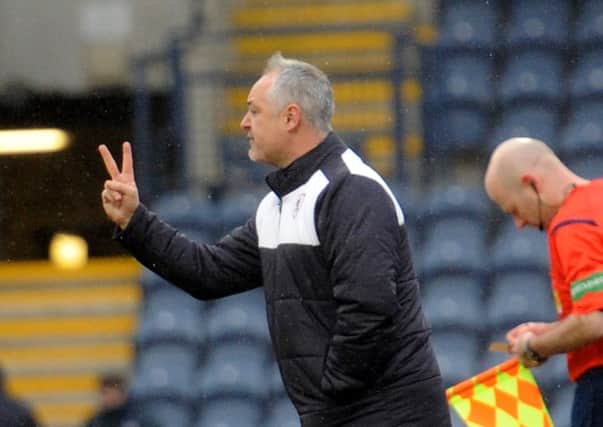 Raith Rovers manager Ray McKinnon gives instructions during Saturday's win over Livingston - Credit - Fife Photo Agency -