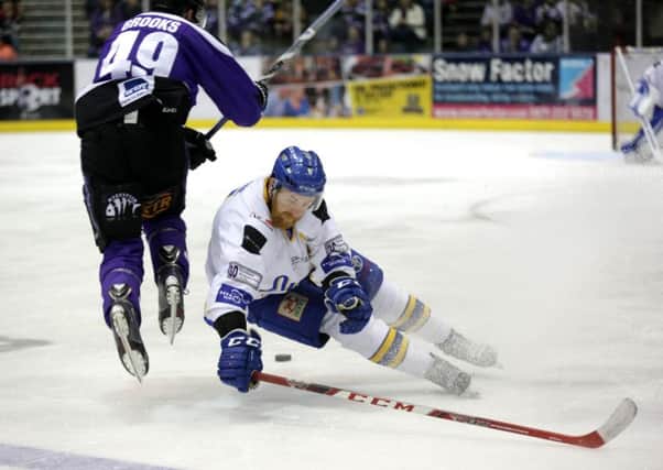 Kyle Horne hurls himself into a body check during Saturdays 5-1 win over Braehead Clan. Pic: Steve Gunn