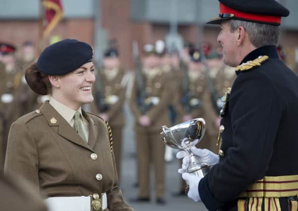 Pictured: Junior Soldier Cruikshank receiving the prize for Education Achievement Award from Lieutenant General Bashall CBE.  All images remain Crown Copyright.  Photo credit: Sgt Jamie Peters RLC