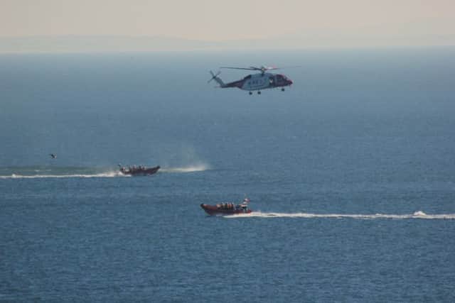 The new helicopter took part in a winching exercise with the lifeboats in Kinghorn Bay