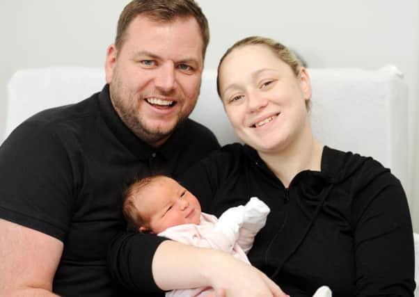 Baby Emily with mum and dad Grant and Kerry.