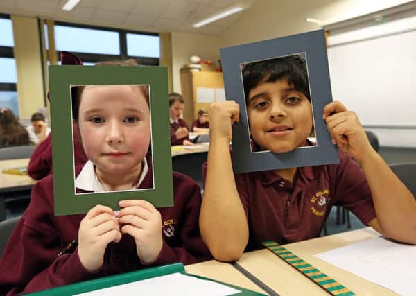 St Columba's Primary School P5 pupils Erin Lowdon and Zain Verna enjoy the picture framing exercise as part of the Cupar charrette.