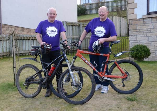 Cupar men Grant Jardine and John Morrow, who are cycling in Burma for charity