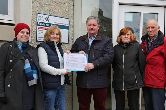 Pictured outside the library with the petition are, from left - Caren Gilbert, Rachel Fraser, Ken Laurie, Margaret Normand and Lars Christinsen.