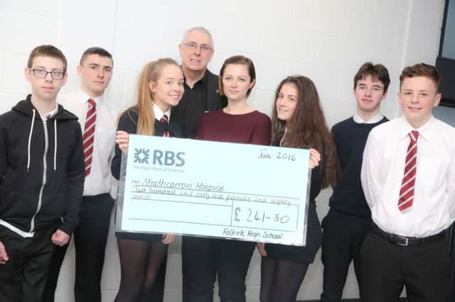 SFFH - 2.45pm FALKIRK, Falkirk High School, Westburn Avenue FK1 5BZ - pic of pupils handing over Â£224 to Strathcarron Hospice they raised by cooking lunch for school staff. Contact Marianne Pollock (01324) 679010. Pic shows (l to r), participating pupils with cheque, and both Strathcarron Hospice rep and teacher looking on:

Kris Smith
Liam Jarvie
Kerys McFarlane
Jim Lawson (Strathcarron Hospice)
Marianne Pollock (Teaching Staff)
Casey Forsyth
Johnny Smart
Greg Todd