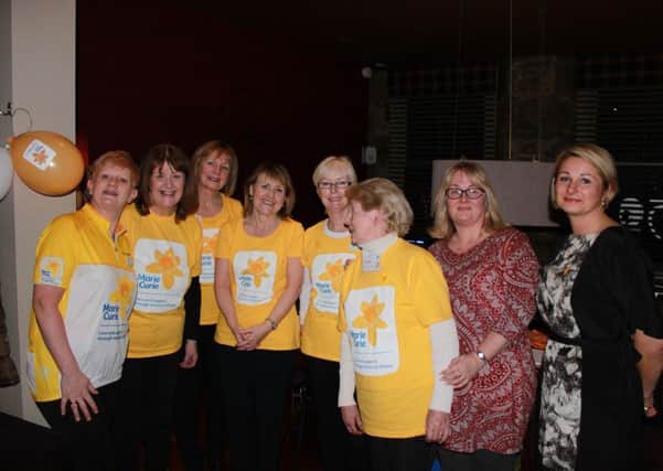 The Kirkcaldy fundraising group of Marie Curie  with charity shop manageress Agata Barker, who organised a fashion and beauty show which raised Â£1000 for the charity.