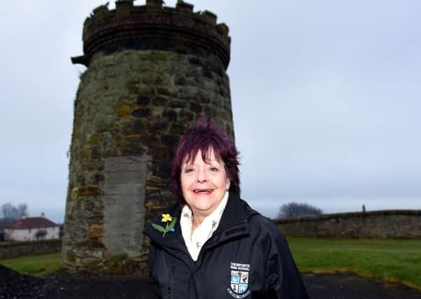 Cllr Kay Carrington outside the windmill which is to be restored. Pic by Fife Photo Agency.