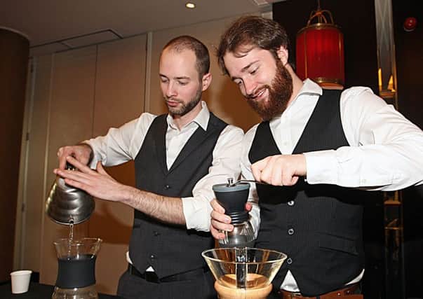 Johnathan Reeves (left) and Matthhew Webb of Zest prepare some coffee.