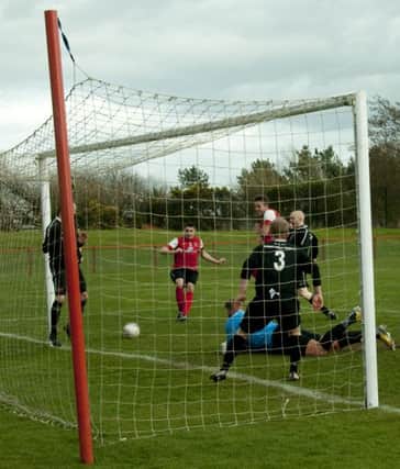 Paul Thomson pounces to score during a previous meeting between Tayport and Broxburn