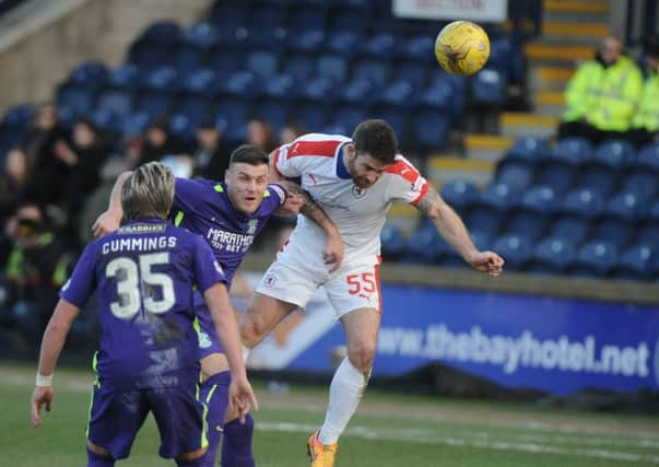 Craig Barr wins a header against Anthony Stokes in Raith's 2-1 win over Hibs on Saturday. Pic: George McLuskie