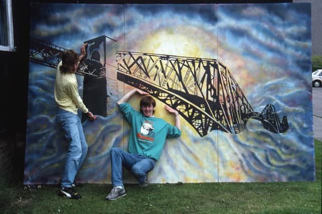 Kdy Boys' Club members Neil and Paul Arnold celebrate the centenary of the Forth Rail Bridge by painting a huge mural which went on to be displayed in the Royal Bank of Scotland in Kirkcaldy.