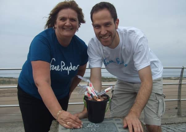 Ben McLeod was delighted to hand over Â£2,572.54 to the Sue Ryder charity following the successful Chariots of Fire race held on the West Sands recently.
Helen Hamilton from Sue Ryder gratefully accepted the money earlier this week at the plaque just yards from where the iconic film was shot.
Ben has been keeping up the charity work recently and plans to run a four half marathons followed by the famous New York marathon later this year to raise yet more money for Sue Ryder.