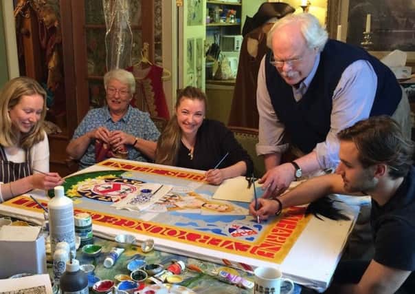 Jessica Stevenson, Wendy Quinault, Austin Schurig, Mark Dennis and Fernando Maluf hard at work making the special 90th Anniversary Banner to be displayed in the 2016 Procession.