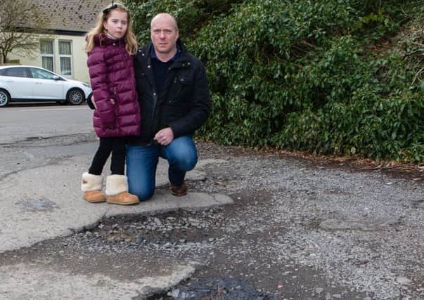 Millie Stewart (7) with Dad Graeme at the location in Coaltown of Balgonie where she was badly hurt. Pic by Steven Brown Photography.
