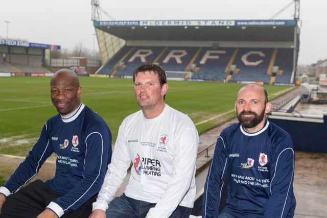 Marvin Andrews, Paul Browne and Colin Cameron with the new shirts to be worn for "Allys Game" at Raith Rovers Charity football game.