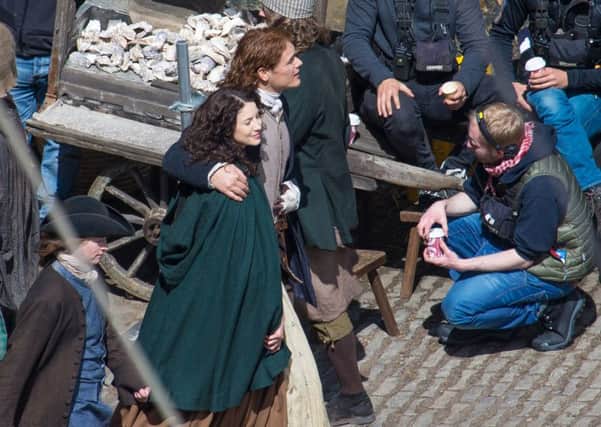 Sam Heughan (Jamie) and Caitriona Balfe (Claire) on set of Outlander Season 2 at Dysart harbour. Pic Steven Brown Photography.