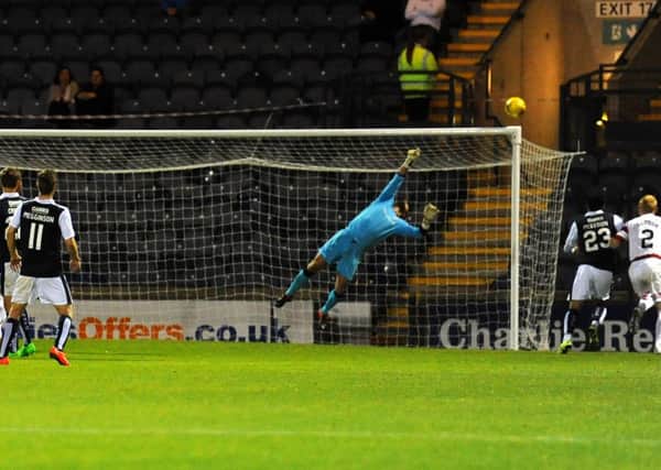 An impressive save from Kevin Cuthbert during a League Cup win over Hamilton on August - Credit - Fife Photo Agency -