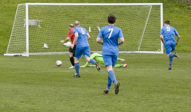 Alan Tulleth rounds the 'keeper to score Tayport's second.
