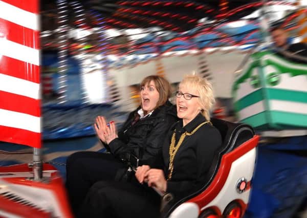 Deputy Provost Kay Morrison, who officially opened the Links Market, tries out one of the rides with Leigh Michie. All pictures - FPA.