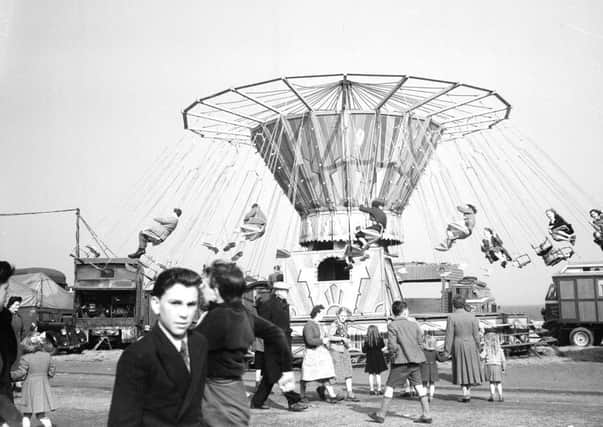 On the chairoplanes, or is it chairplanes, at the Links Market in 1952
