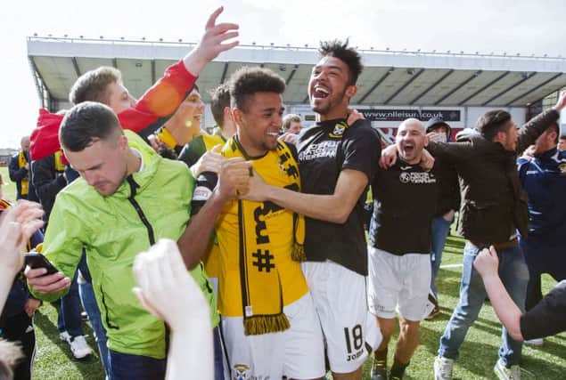 Nathan Austin celebrates with brother Jordan following East Fife's title win.