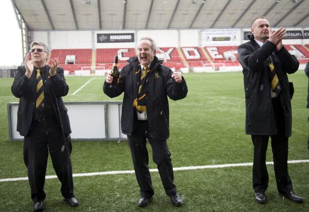 Mr Stevenson, left, celebrates East Fife's title win.