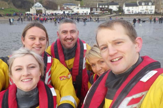 Some of the volunteer crew at sea in front of the Kinghorn lifeboat station